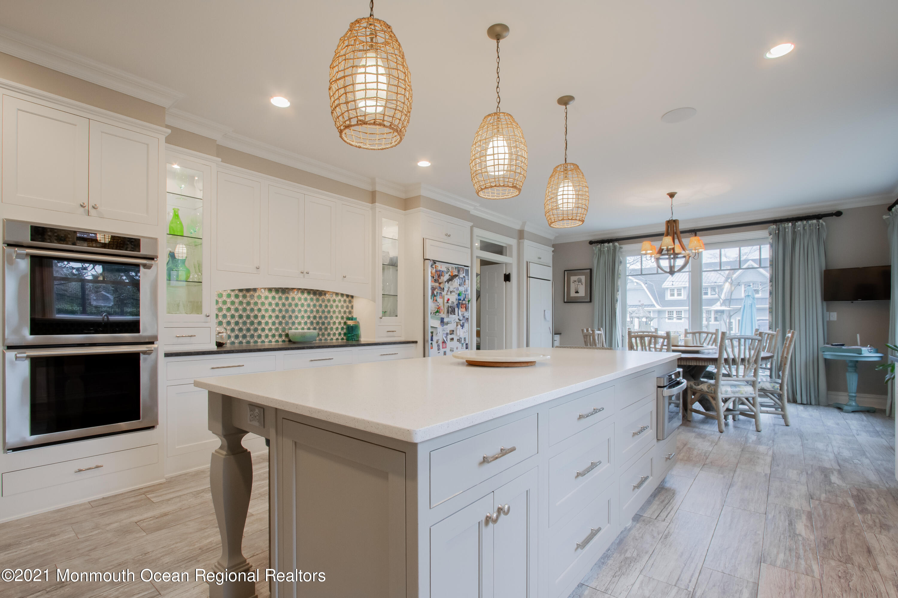 451 Little Silver Point Road Little Silver, NJ 07739 - Photo 15 of 63 a large kitchen with kitchen island stainless steel appliances a table chairs sink and flat screen tv