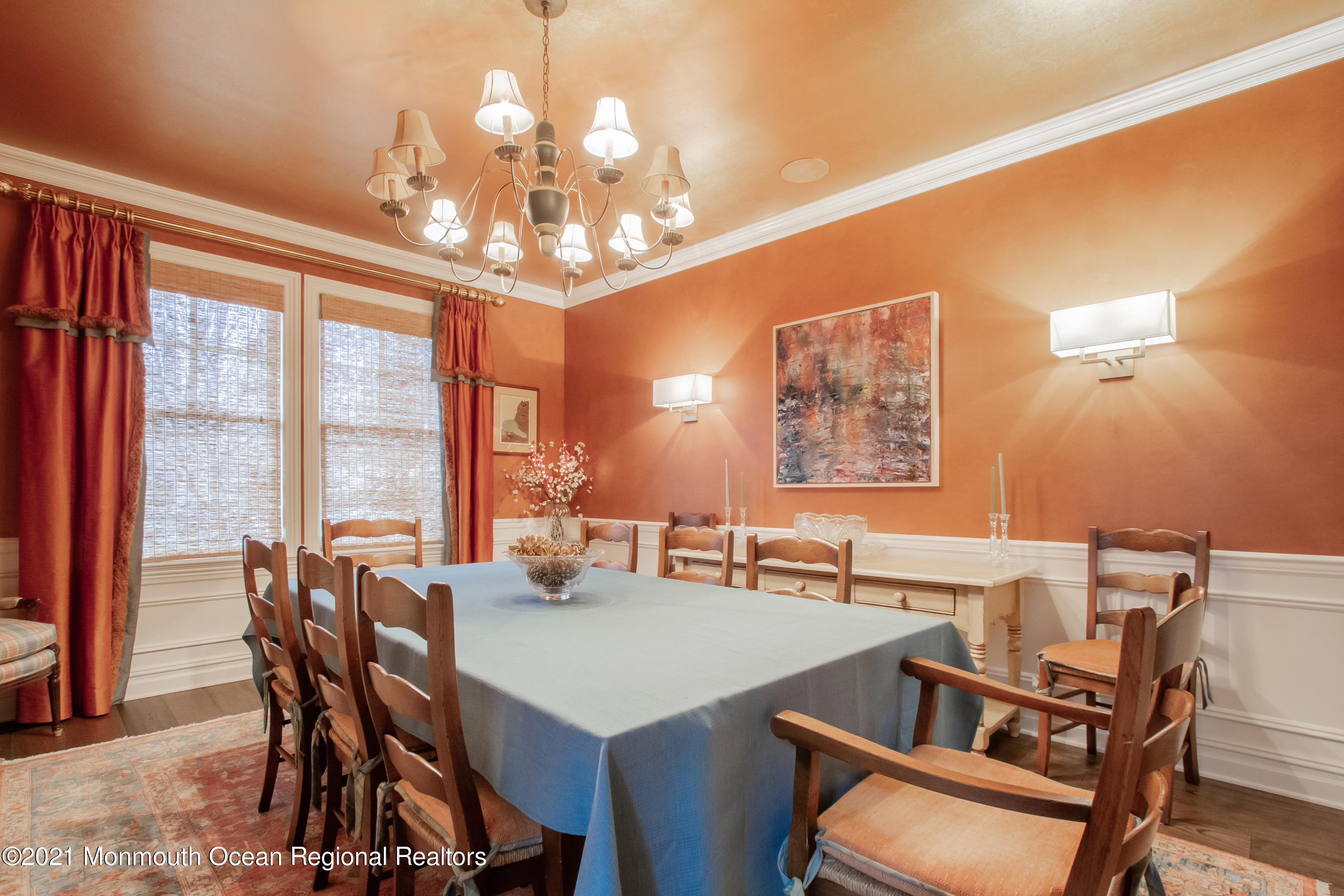 451 Little Silver Point Road Little Silver, NJ 07739 - Photo 27 of 63 a view of a dining room with furniture large windows and a chandelier