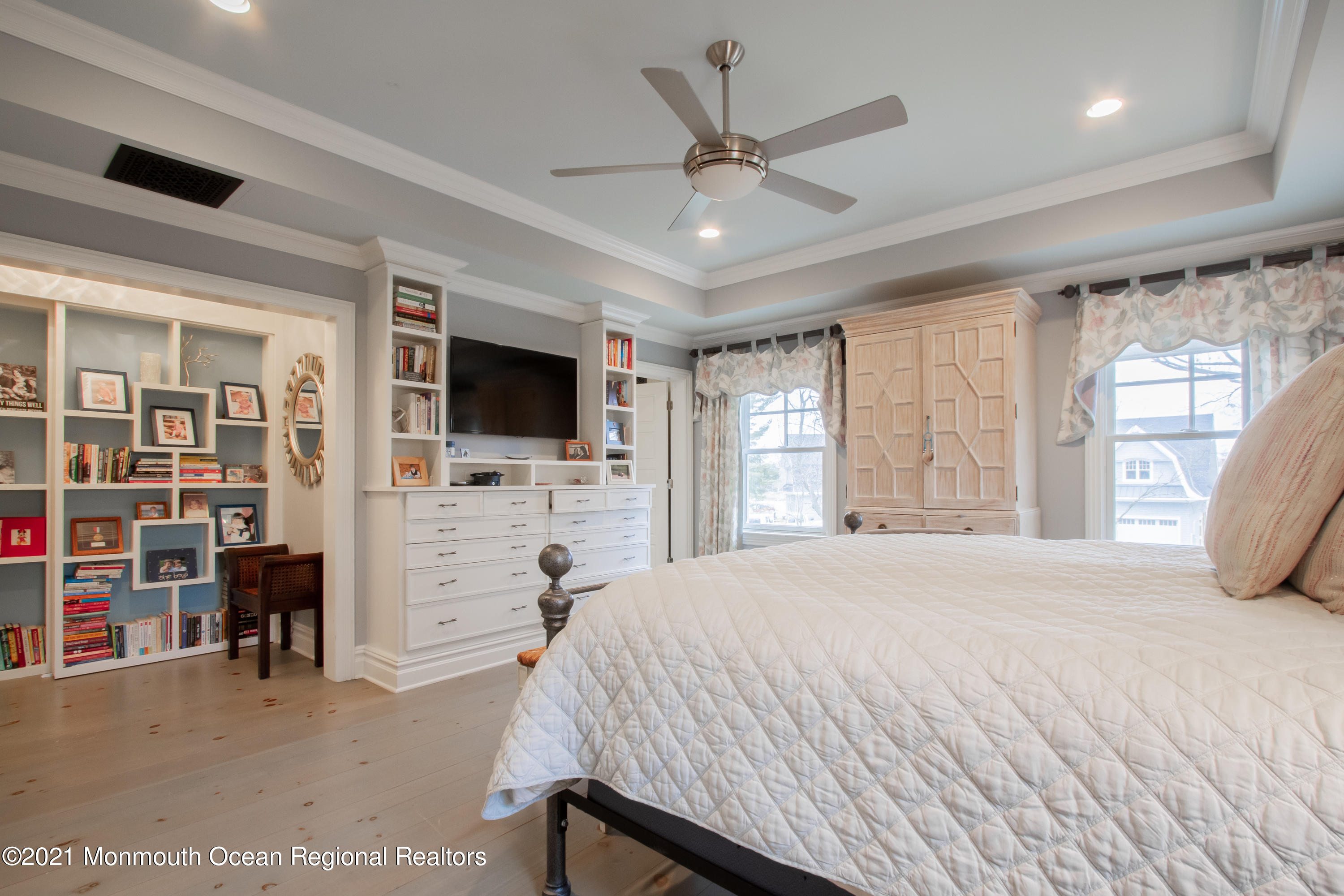 451 Little Silver Point Road Little Silver, NJ 07739 - Photo 32 of 63 a spacious bedroom with a bed and a flat screen tv