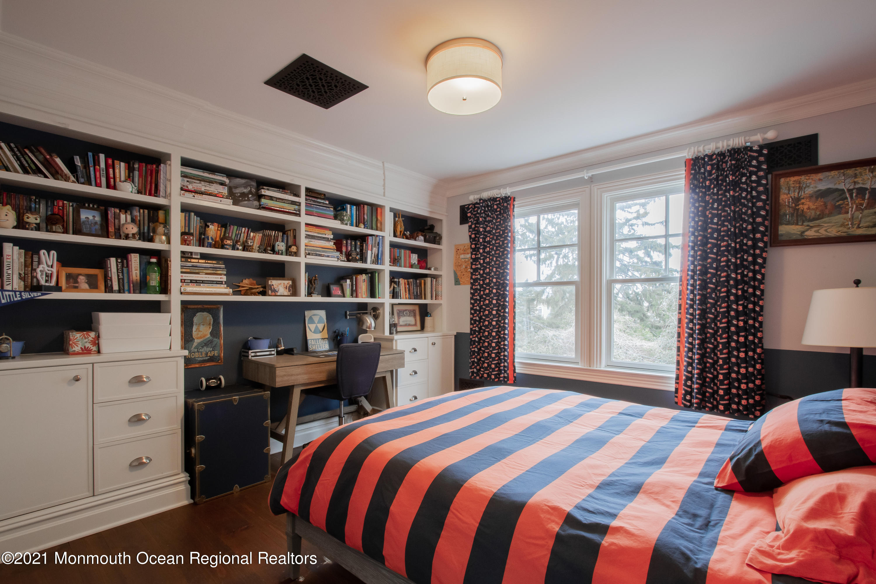 451 Little Silver Point Road Little Silver, NJ 07739 - Photo 35 of 63 a bedroom with a bed and a bookshelf