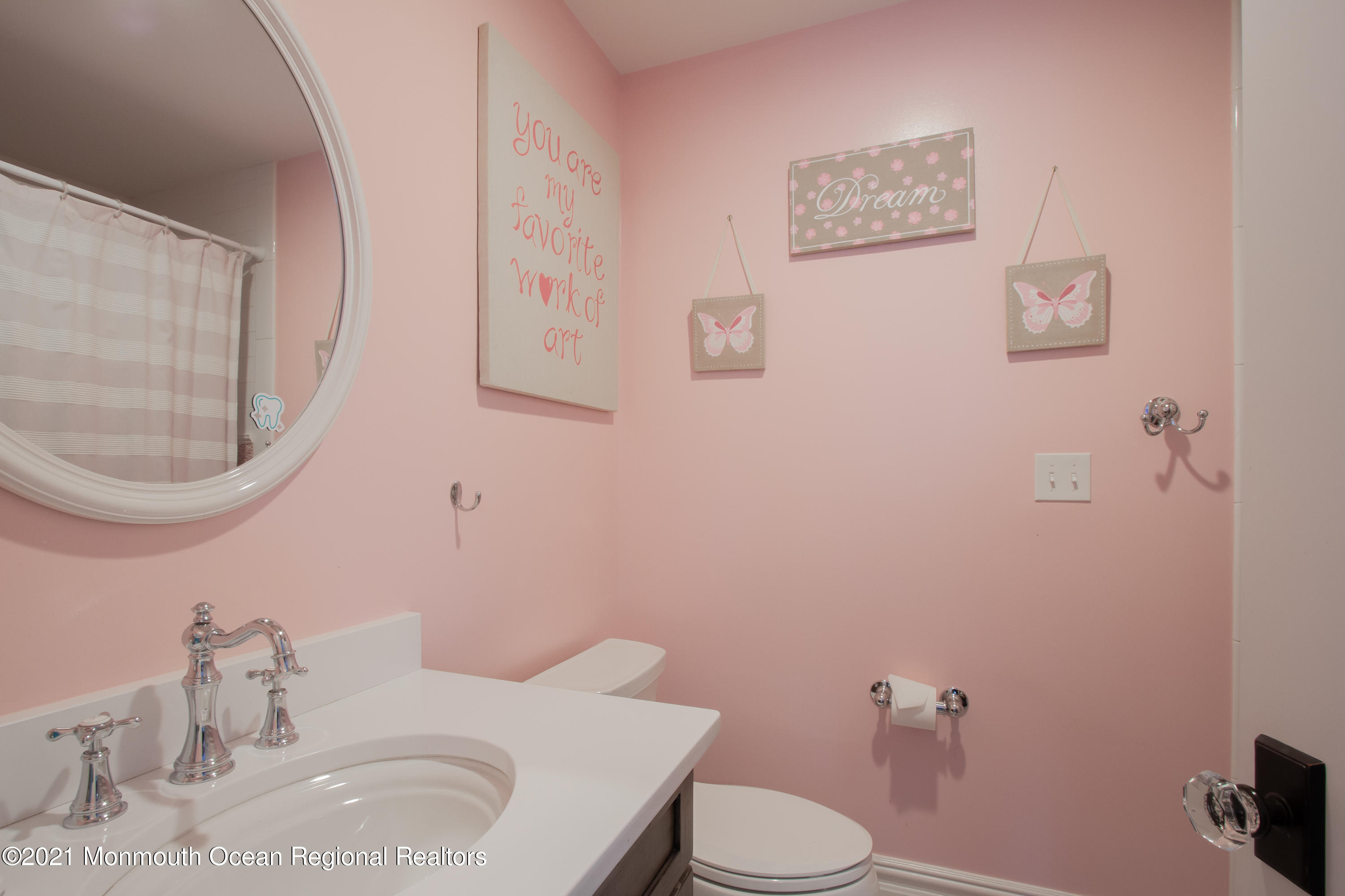 451 Little Silver Point Road Little Silver, NJ 07739 - Photo 39 of 63 a bathroom with a sink a toilet and a mirror