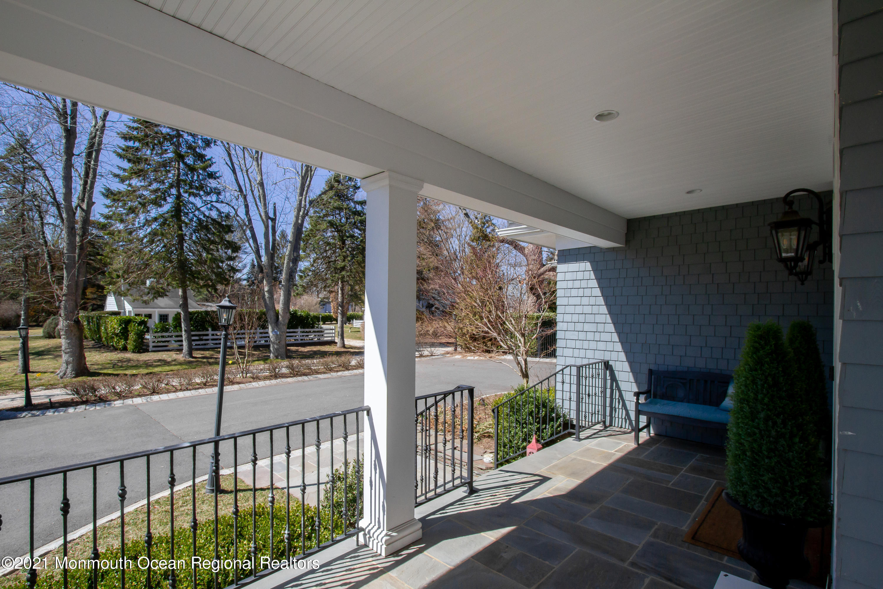 451 Little Silver Point Road Little Silver, NJ 07739 - Photo 5 of 63 a view of a porch with a floor to ceiling window and wooden fence