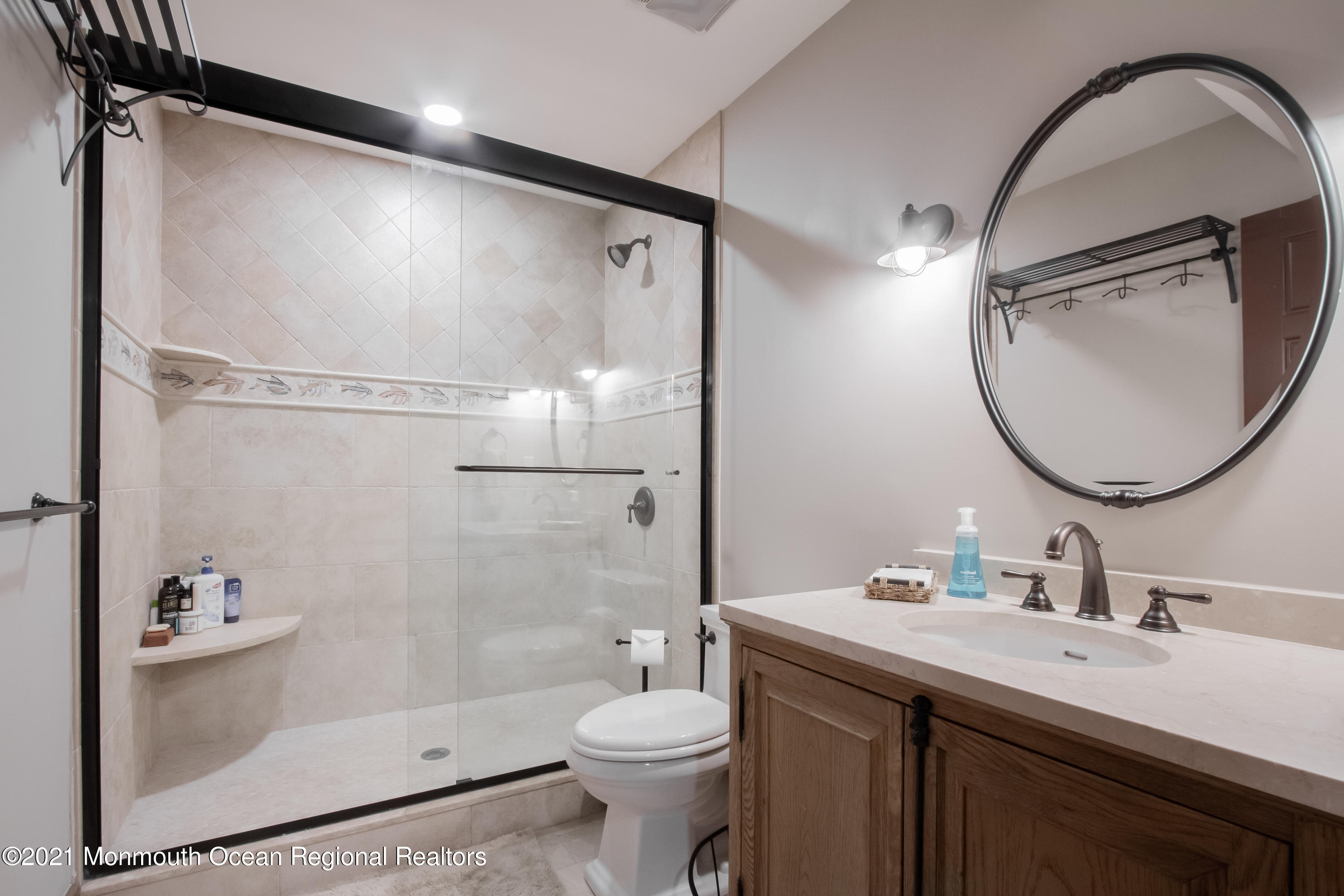 451 Little Silver Point Road Little Silver, NJ 07739 - Photo 46 of 63 a bathroom with a sink toilet and shower