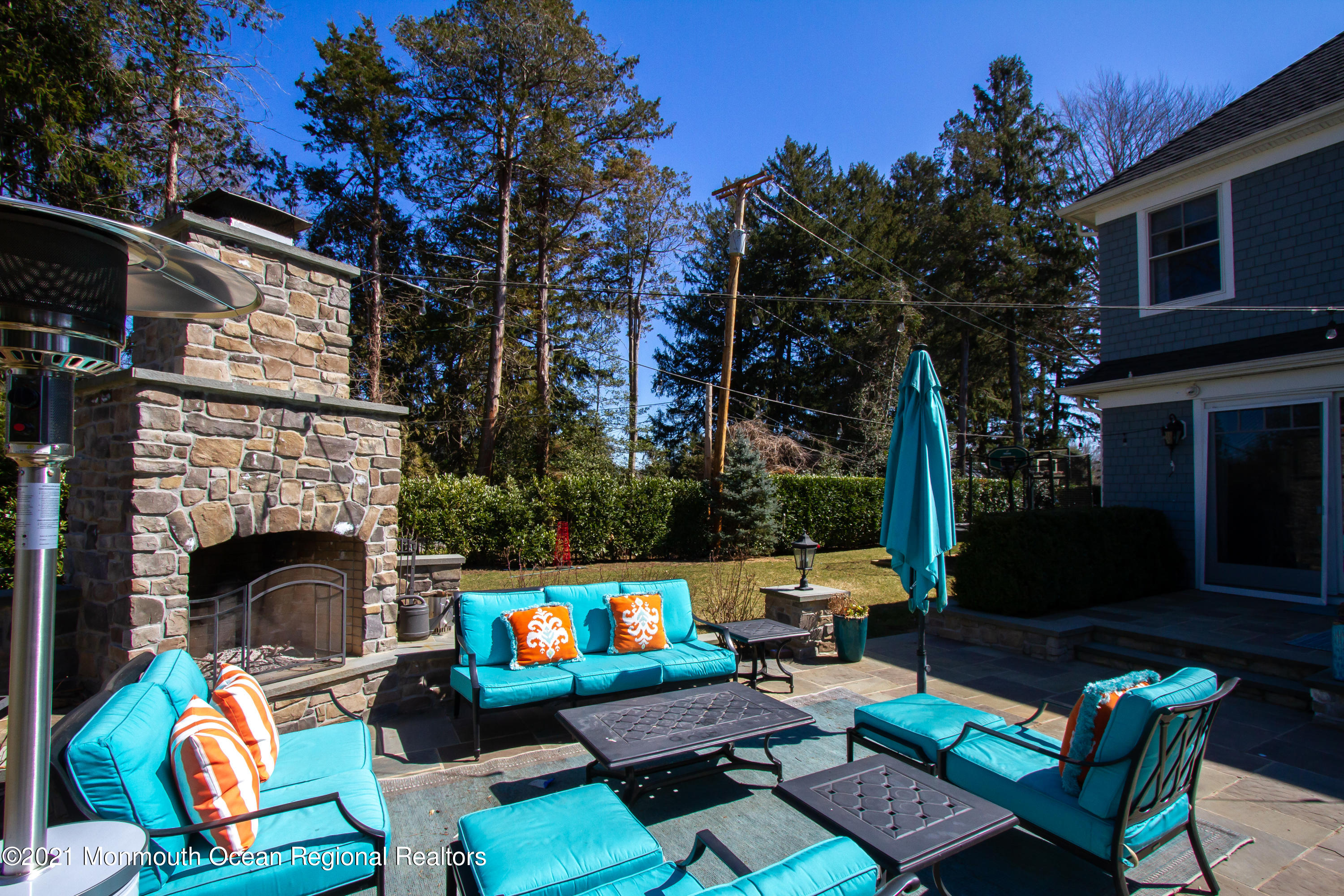 451 Little Silver Point Road Little Silver, NJ 07739 - Photo 54 of 63 a view of a chairs and table in the back yard of the house