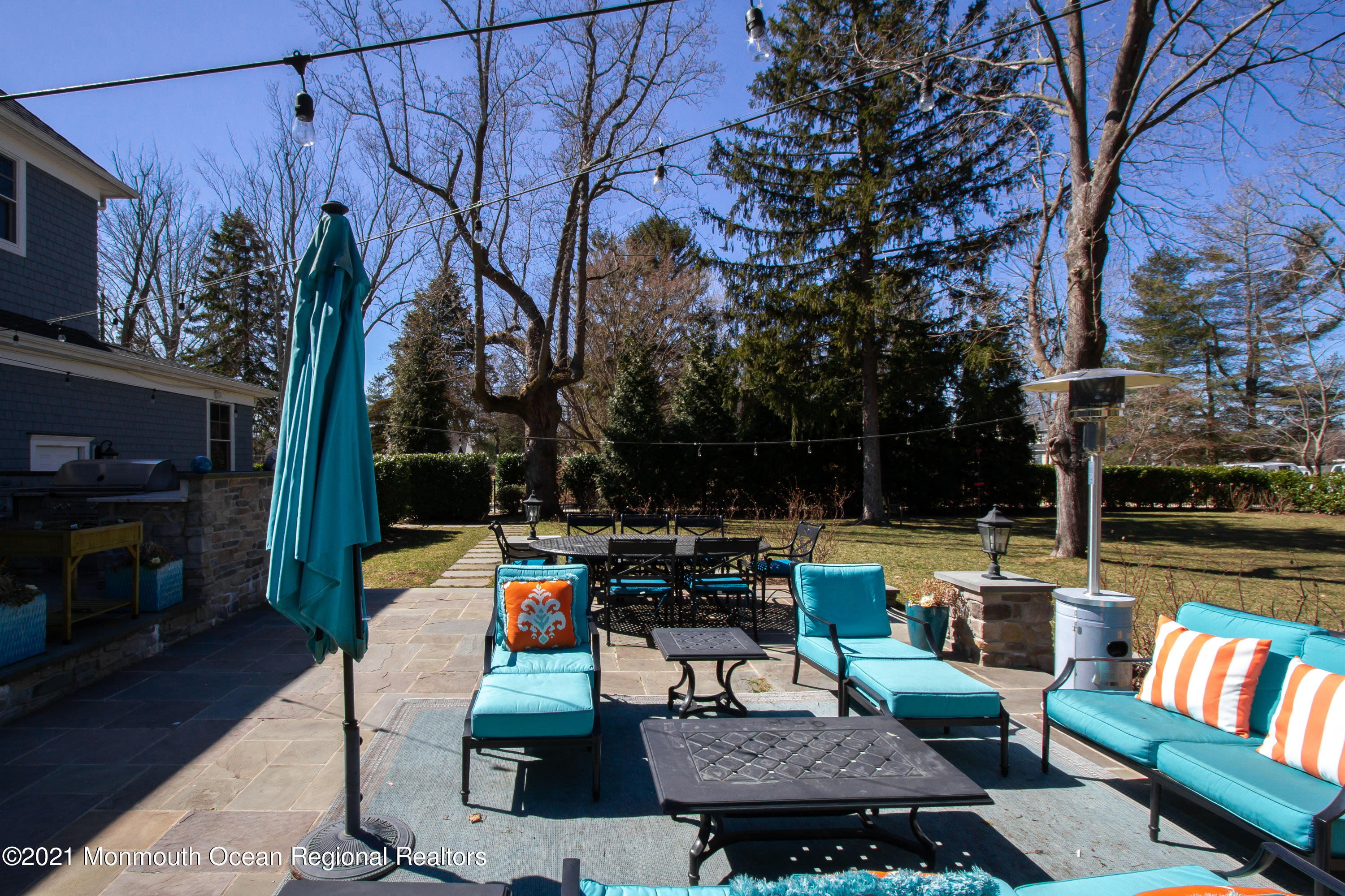451 Little Silver Point Road Little Silver, NJ 07739 - Photo 55 of 63 a view of a patio with couches table and chairs with wooden floor and fence