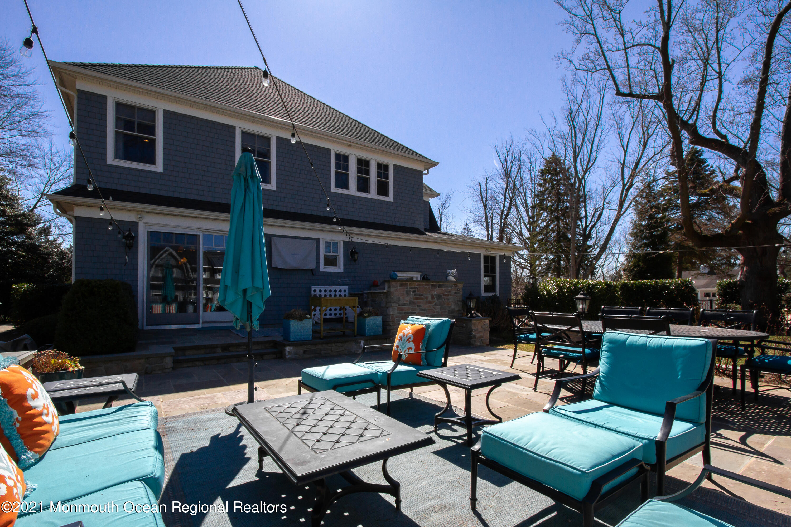 451 Little Silver Point Road Little Silver, NJ 07739 - Photo 57 of 63 a backyard of a house with fire pit and outdoor seating