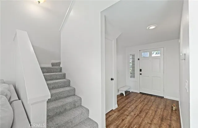 a view of a room with stair & door
