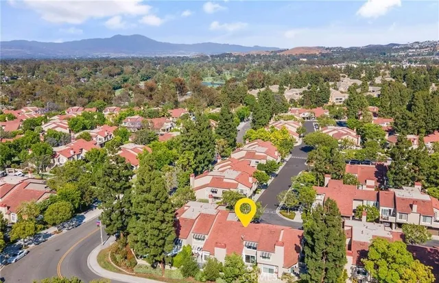 an aerial view of a house with a swimming pool