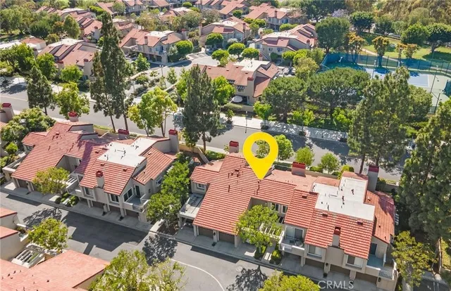 an aerial view of a house with a ocean view