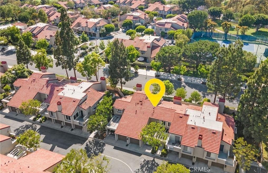 164 Stanford Court, Unit 82 Irvine, CA 92612 - Photo 30 of 34 an aerial view of a house with a swimming pool