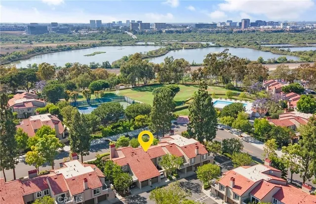 an aerial view of a house with a garden and swimming pool