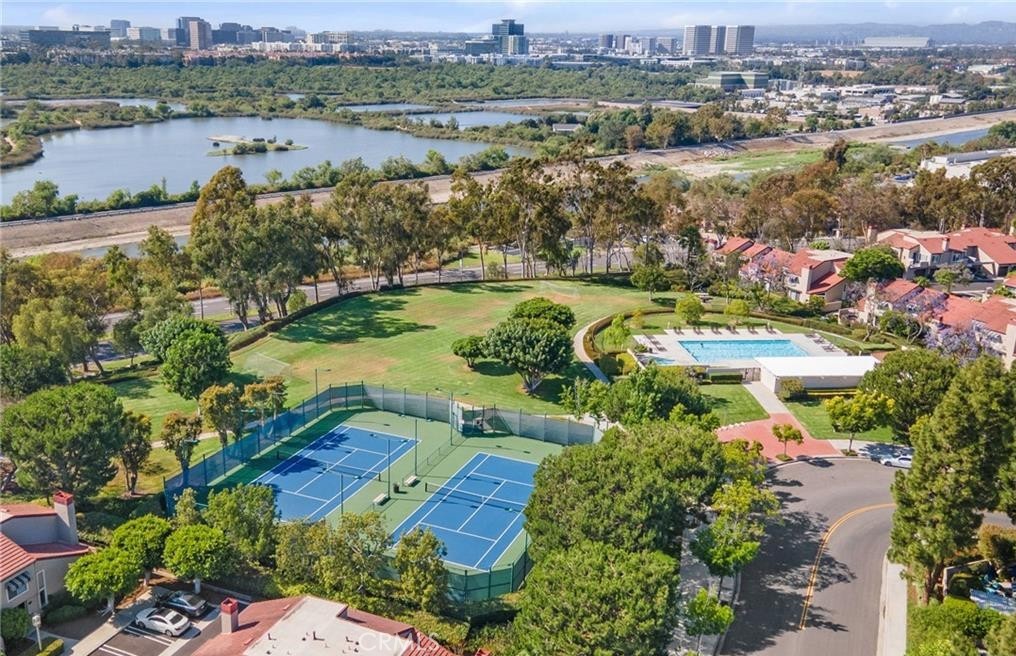 164 Stanford Court, Unit 82 Irvine, CA 92612 - Photo 34 of 34 an aerial view of residential houses with outdoor space and lake view