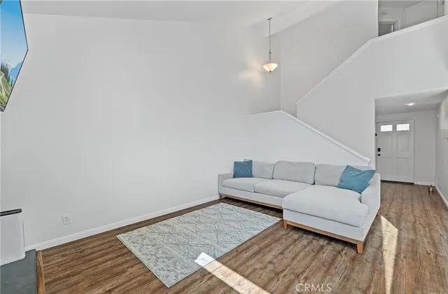 a living room with furniture and a rug
