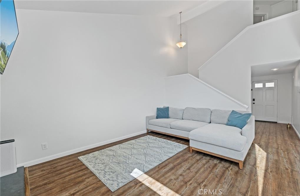 164 Stanford Court, Unit 82 Irvine, CA 92612 - Photo 6 of 34 a living room with furniture and a rug