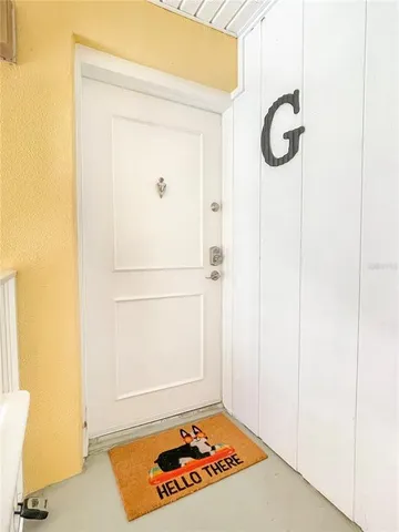 a view of a room with rack on the wall and a window