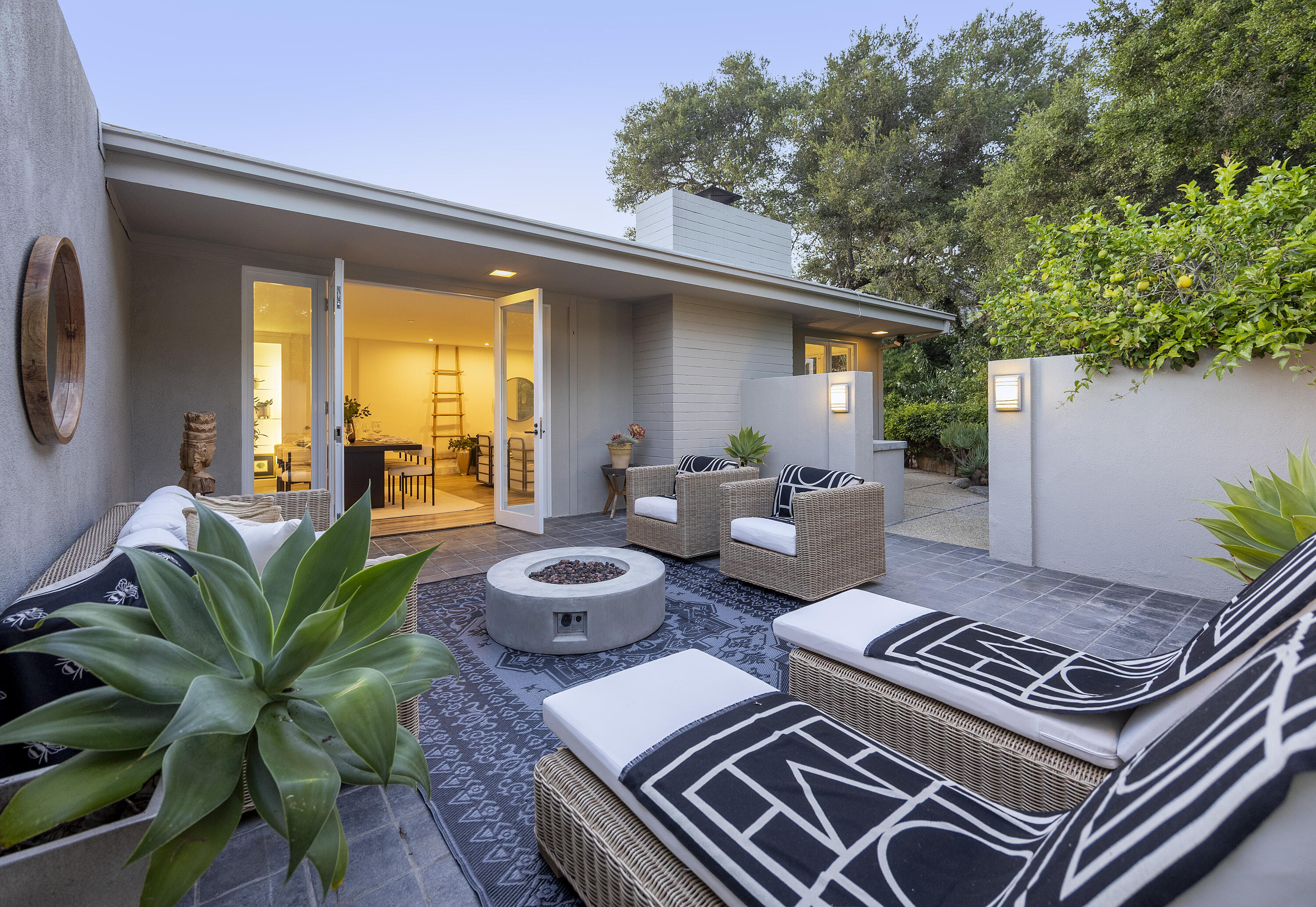 1524 East Valley Road Montecito, CA 93108 - Photo 14 of 19 a view of a patio with couches table and chairs and potted plants