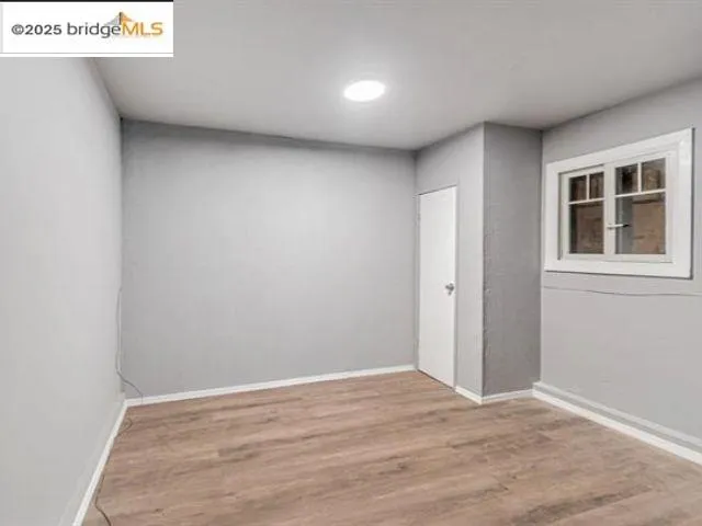a kitchen with a stove top oven and cabinets