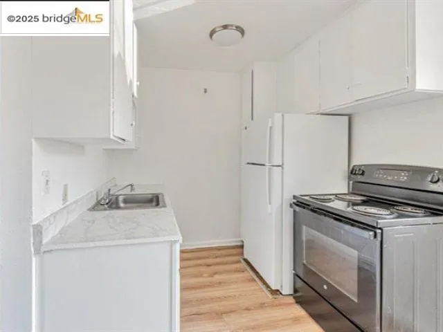 a bathroom with a sink a mirror and shower