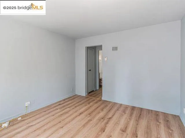 a view of a hallway with washer and dryer
