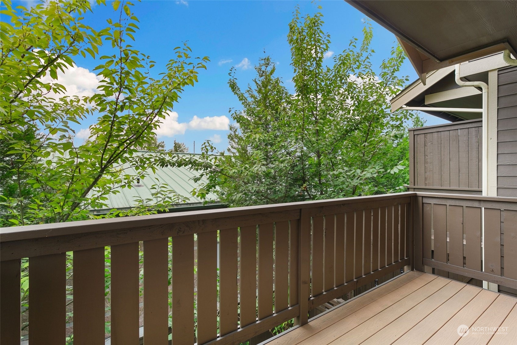 4600 Northeast 3rd Lane, Unit E1 Renton, WA 98059 - Photo 12 of 35 a balcony with wooden floor