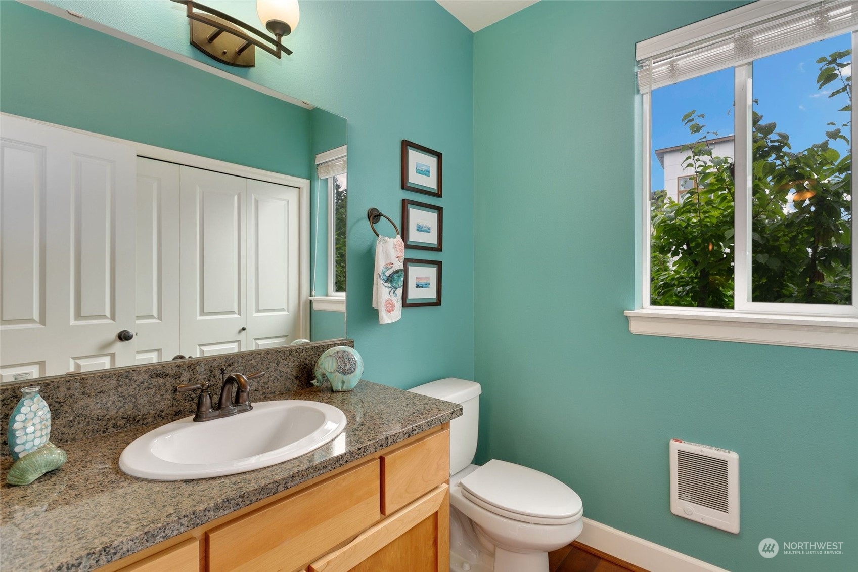 4600 Northeast 3rd Lane, Unit E1 Renton, WA 98059 - Photo 13 of 35 a bathroom with a granite countertop sink and a mirror