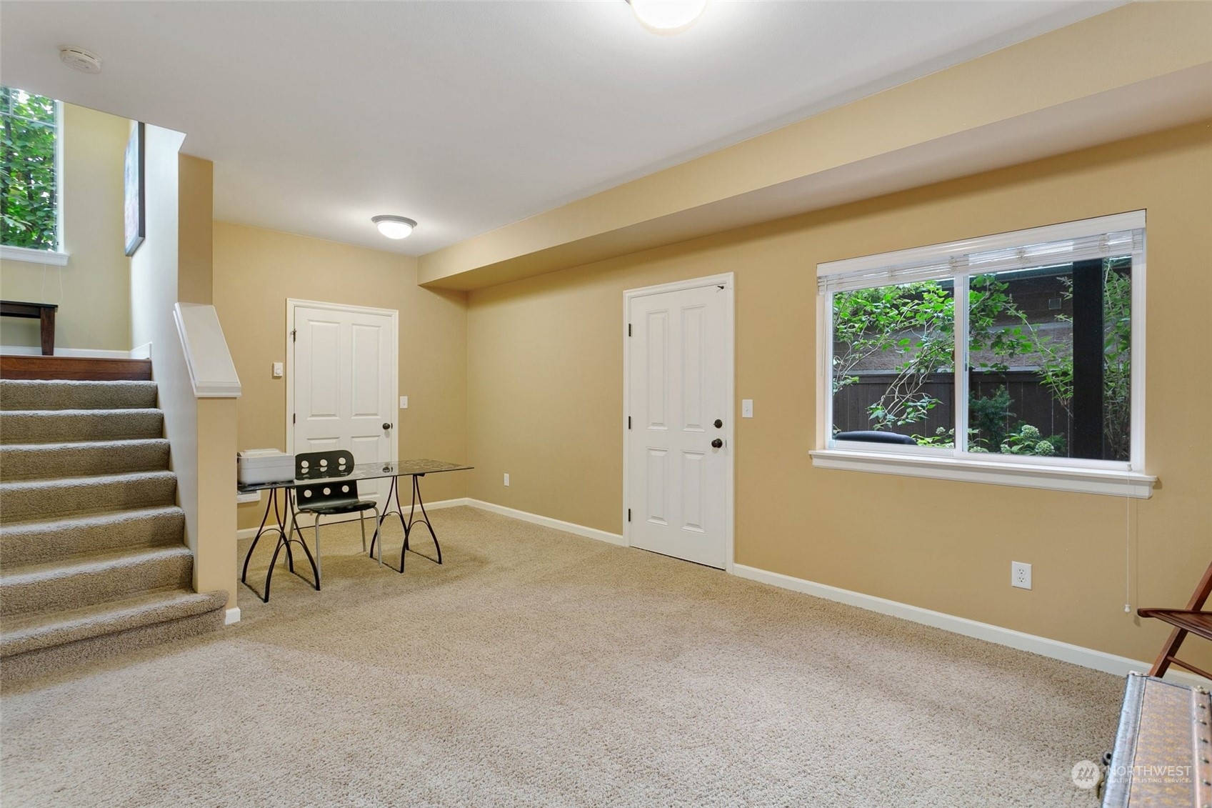 4600 Northeast 3rd Lane, Unit E1 Renton, WA 98059 - Photo 18 of 35 a view of an empty room with stairs and a window