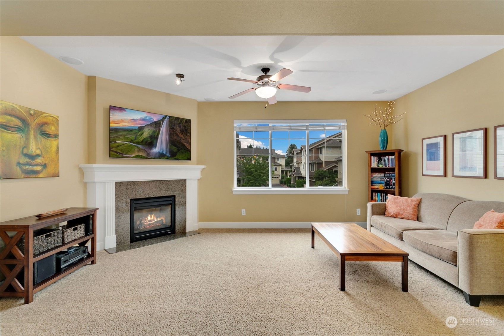 4600 Northeast 3rd Lane, Unit E1 Renton, WA 98059 - Photo 2 of 35 a living room with furniture a fireplace and a flat screen tv