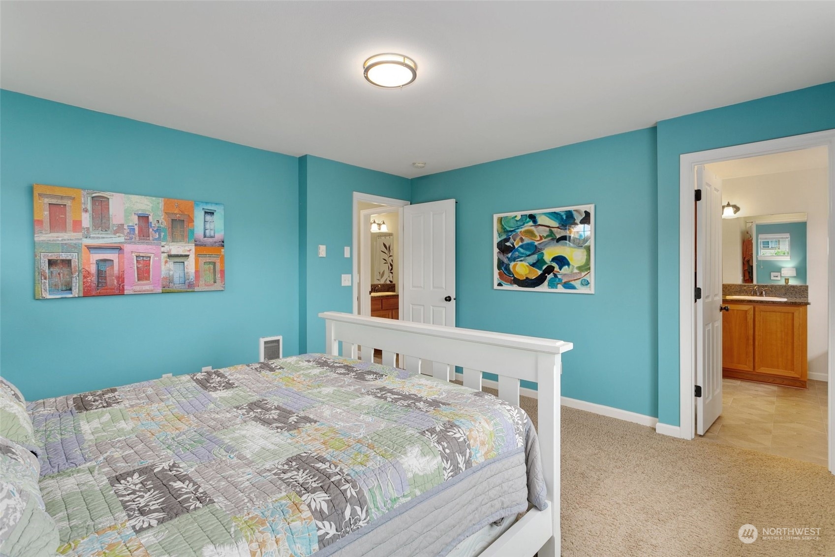 4600 Northeast 3rd Lane, Unit E1 Renton, WA 98059 - Photo 23 of 35 a bedroom with a bed and a painting on the wall