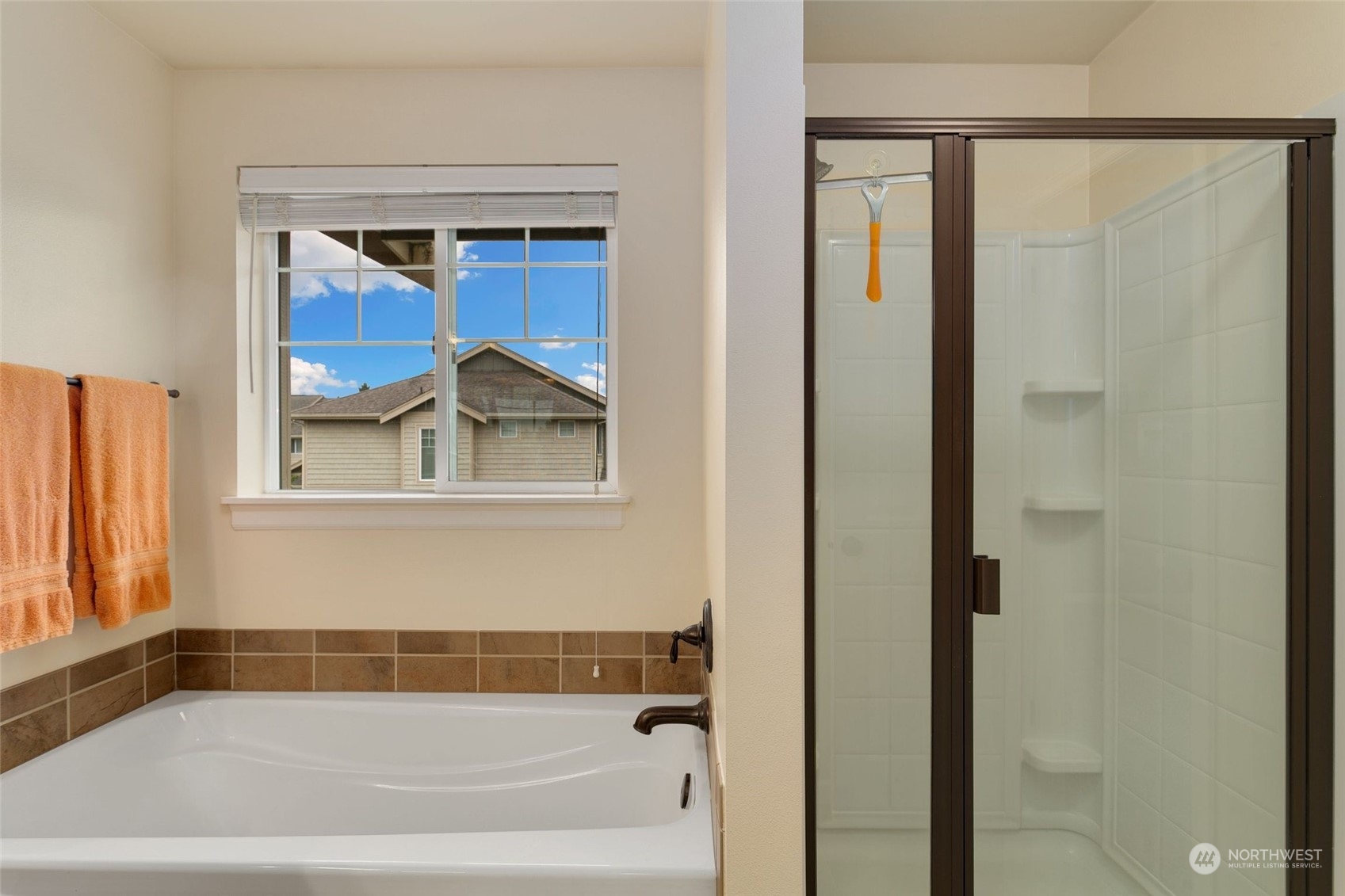 4600 Northeast 3rd Lane, Unit E1 Renton, WA 98059 - Photo 25 of 35 a bathroom with a bathtub and a window