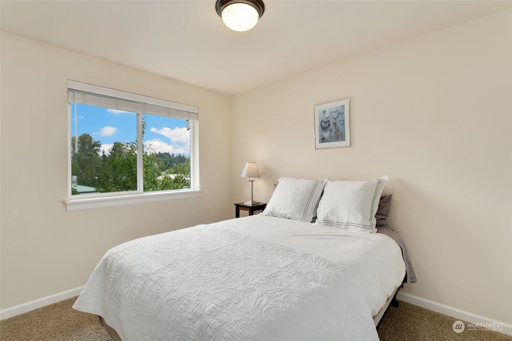 4600 Northeast 3rd Lane, Unit E1 Renton, WA 98059 - Photo 27 of 35 a large bed in a bedroom next to a window