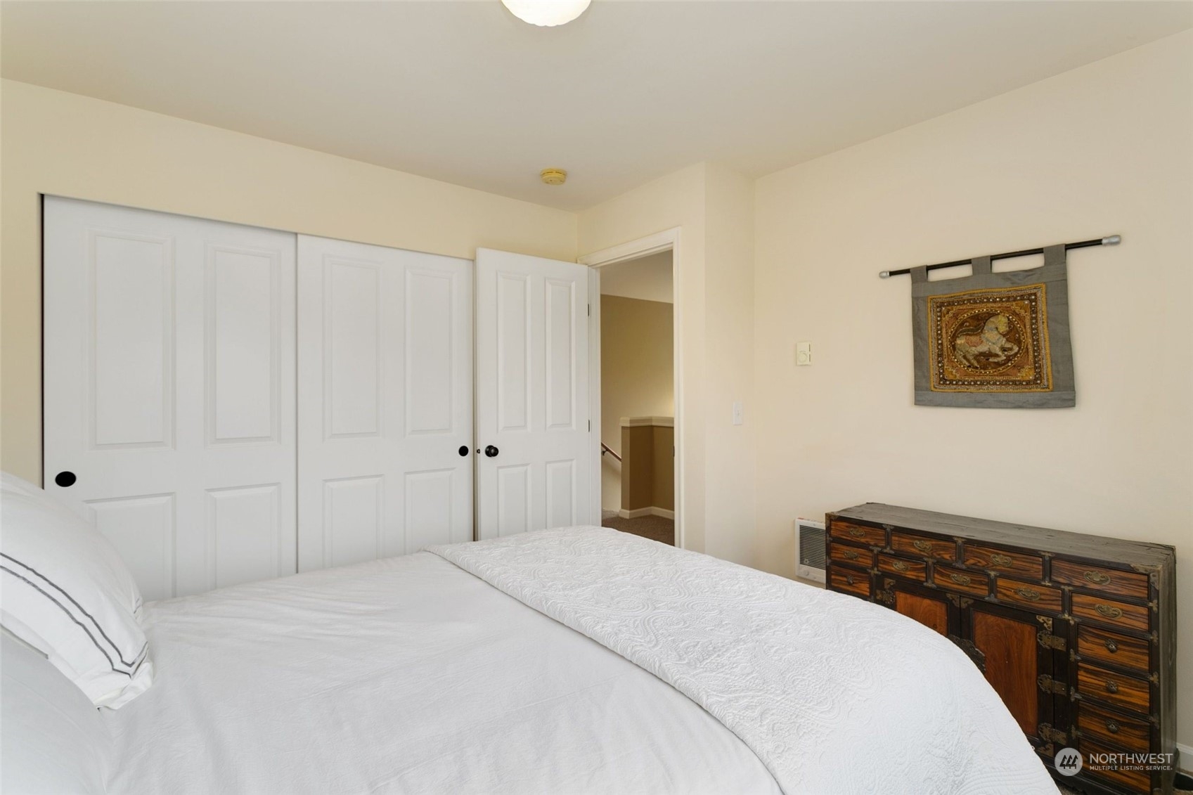 4600 Northeast 3rd Lane, Unit E1 Renton, WA 98059 - Photo 28 of 35 a bedroom with a bed and a cabinets