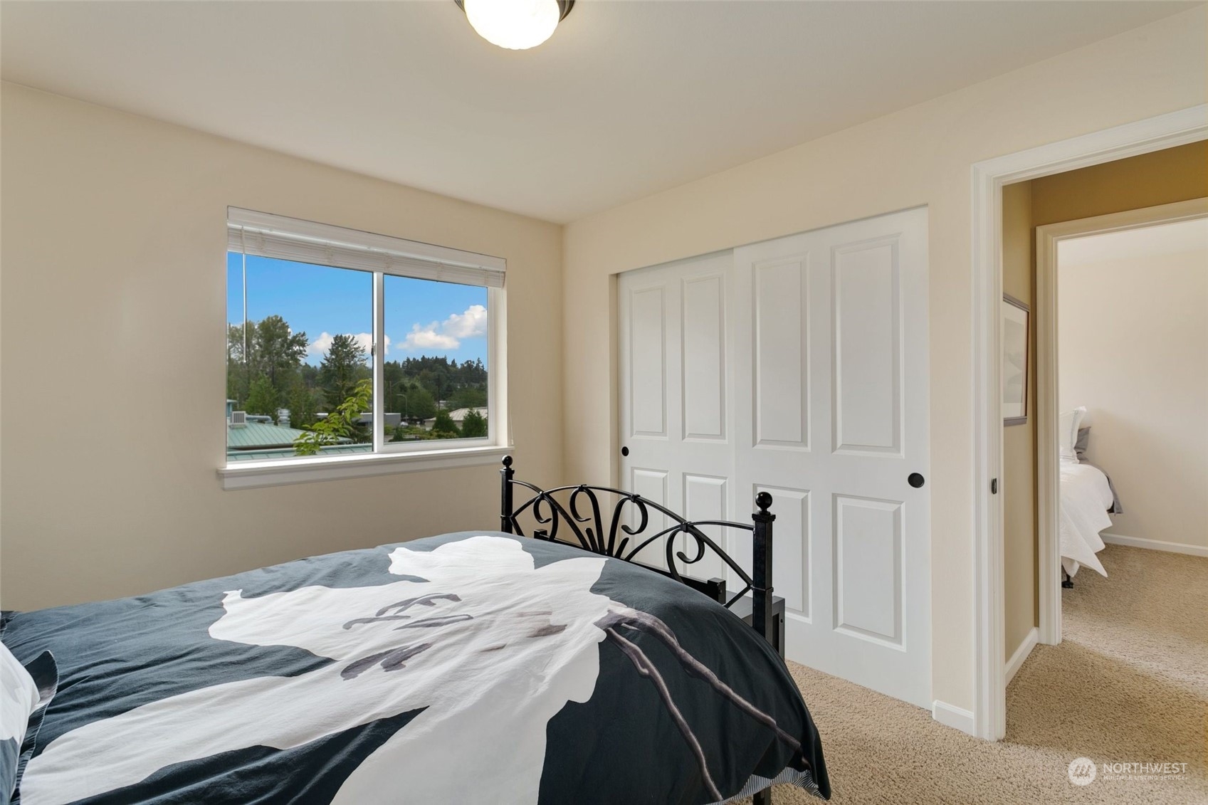 4600 Northeast 3rd Lane, Unit E1 Renton, WA 98059 - Photo 31 of 35 a bedroom with a bed and a window