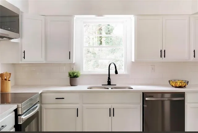 a kitchen with a sink and cabinets