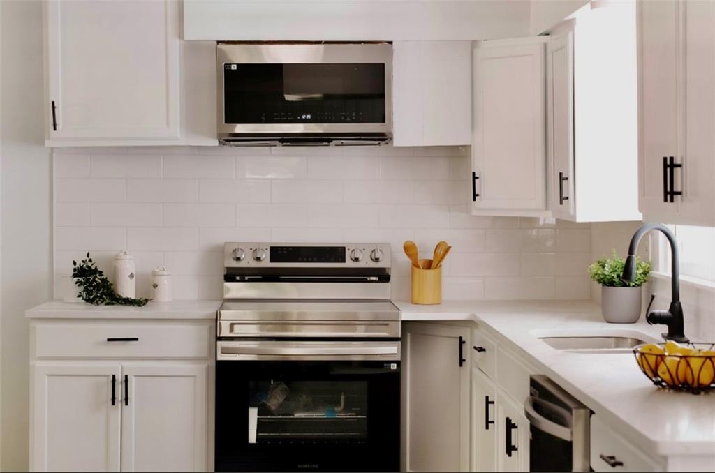 2343 Dawn Drive Decatur, GA 30032 - Photo 12 of 20 a kitchen with a stove and a microwave