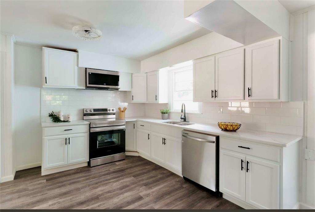 2343 Dawn Drive Decatur, GA 30032 - Photo 10 of 20 a kitchen with appliances cabinets and a sink