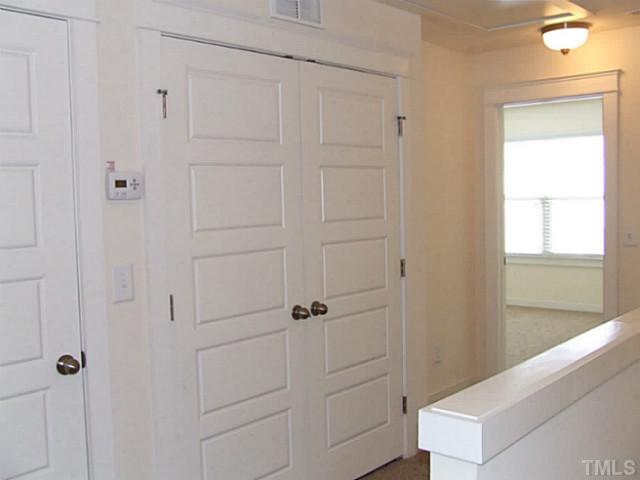 7843 Allscott Way Raleigh, NC 27612 - Photo 13 of 21 laundry upstairs convenient to bedrooms in a spacious and wide hall.