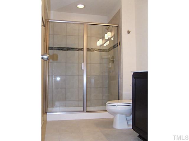 7843 Allscott Way Raleigh, NC 27612 - Photo 10 of 21 MBA shower is 5' with tile surround and accent tile. Elongated toilet and adult height counters!