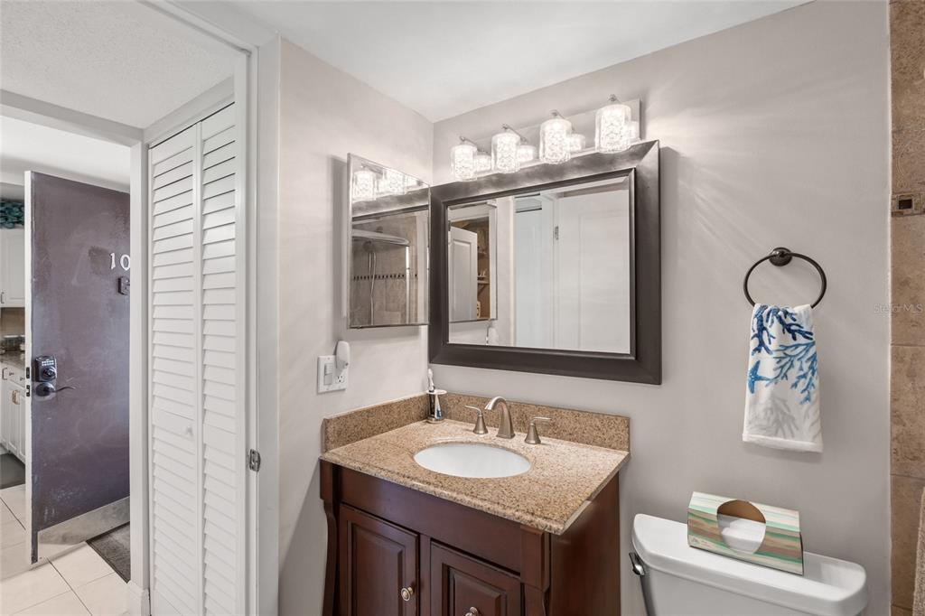 1630 Stickney Point Road, Unit 101 Sarasota, FL 34231 - Photo 20 of 40 a bathroom with a sink and a mirror