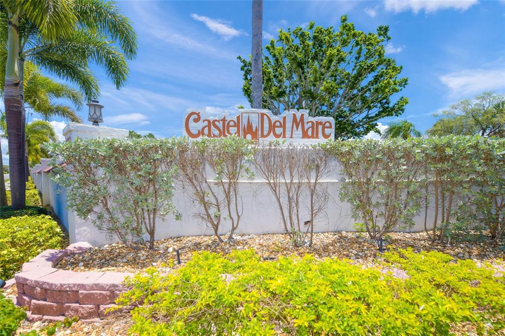 1630 Stickney Point Road, Unit 101 Sarasota, FL 34231 - Photo 26 of 40 a sign that is sitting on a brick wall