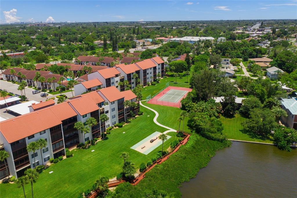 1630 Stickney Point Road, Unit 101 Sarasota, FL 34231 - Photo 32 of 40 an aerial view of a house with a garden