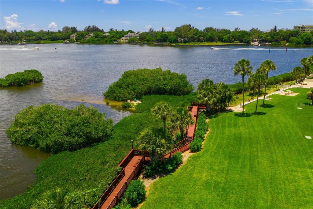 1630 Stickney Point Road, Unit 101 Sarasota, FL 34231 - Photo 35 of 40 a view of a lake with a city