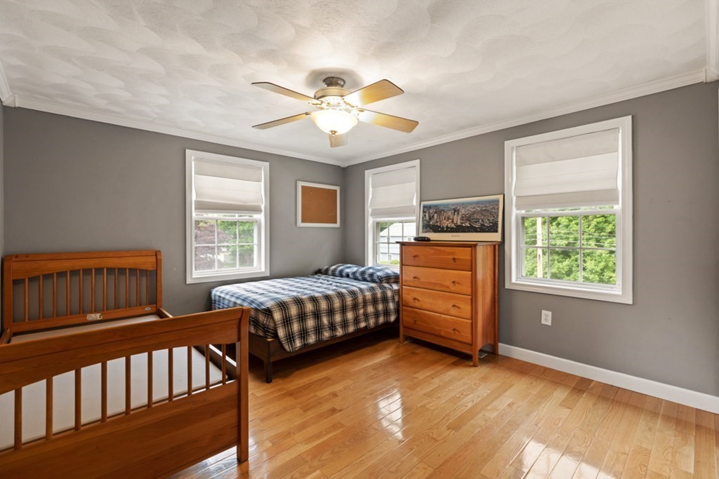 9 Campbell Road Billerica, MA 01821 - Photo 17 of 31 a bedroom with a baby crib and a dresser