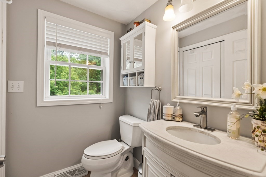 9 Campbell Road Billerica, MA 01821 - Photo 25 of 31 a bathroom with a sink a toilet and a window
