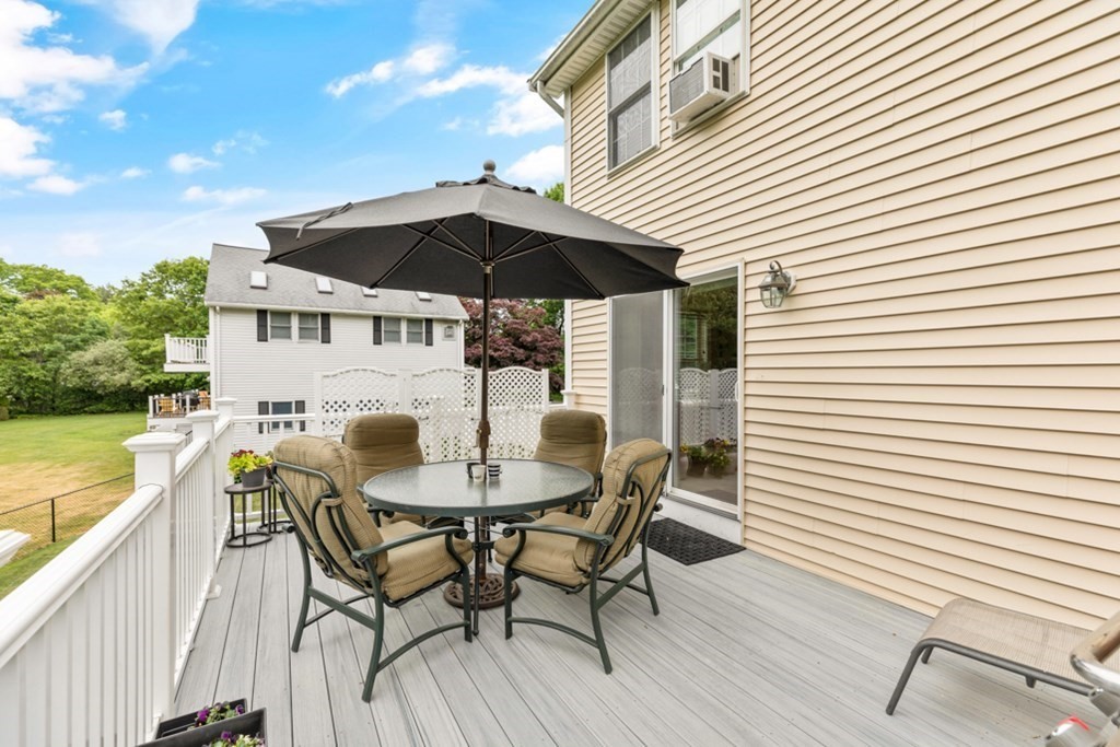 9 Campbell Road Billerica, MA 01821 - Photo 28 of 31 a view of a patio with a table and chairs under an umbrella