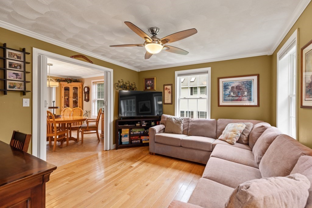 9 Campbell Road Billerica, MA 01821 - Photo 4 of 31 a living room with furniture flat screen tv and wooden floor