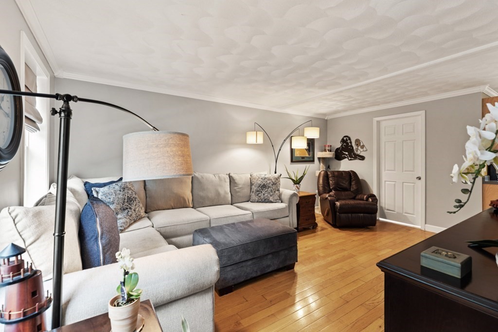 9 Campbell Road Billerica, MA 01821 - Photo 6 of 31 a living room with furniture and a flat screen tv