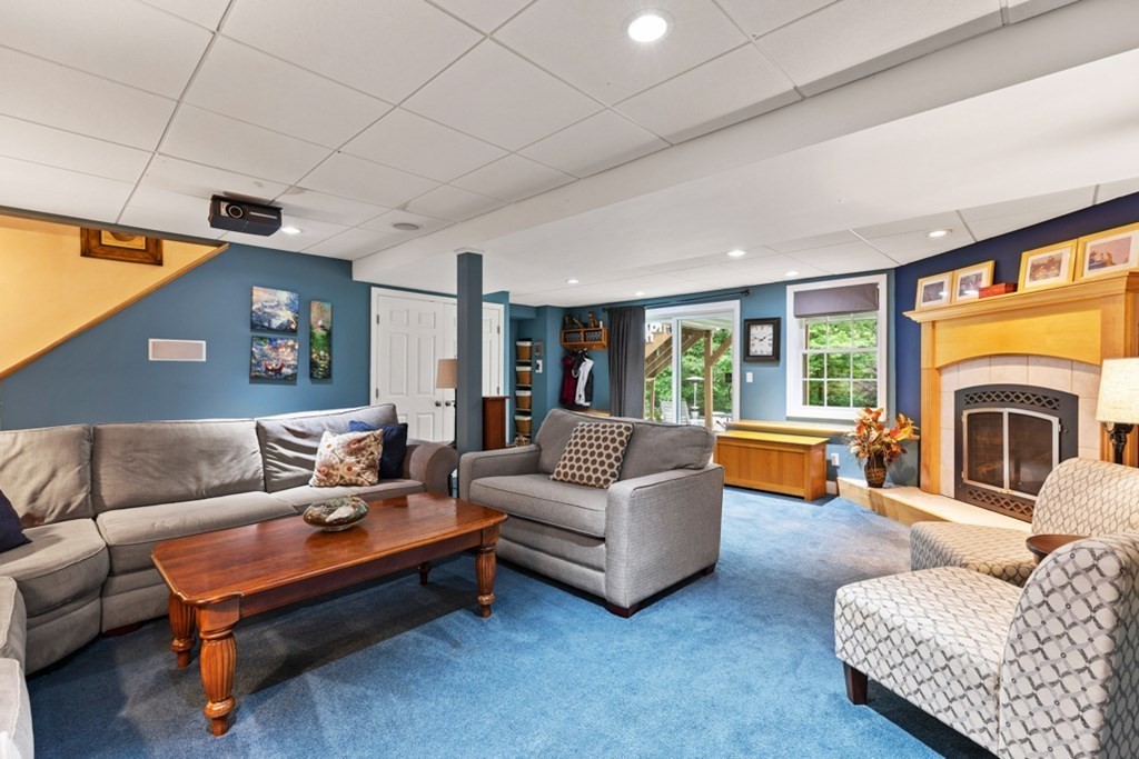9 Campbell Road Billerica, MA 01821 - Photo 10 of 31 a living room with furniture and a fireplace