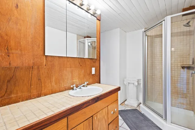 a bathroom with a sink and a mirror