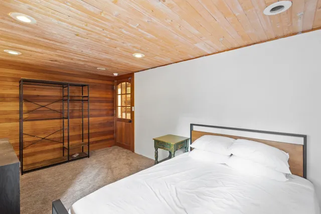 a bedroom with a bed and a cabinets