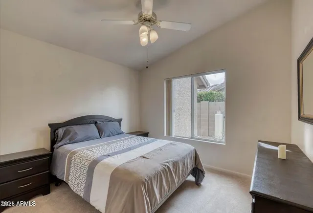 a bedroom with a bed and window